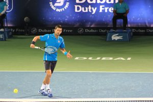 Djokovic hitting a backhand